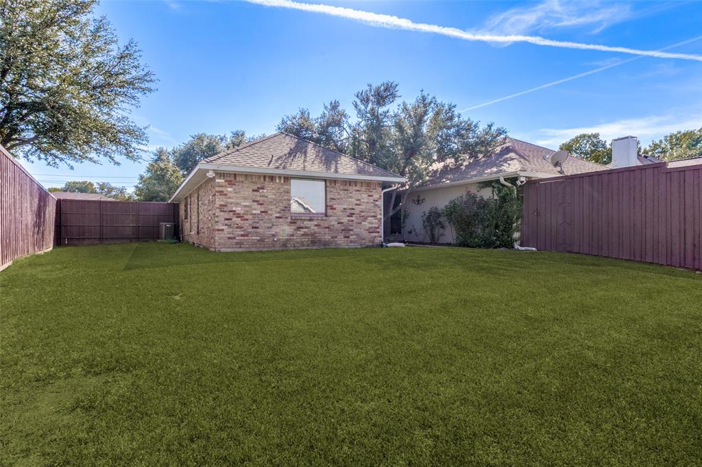 Private backyard with a beautiful fence.