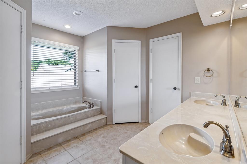 Two large walk in closets and double sinks.