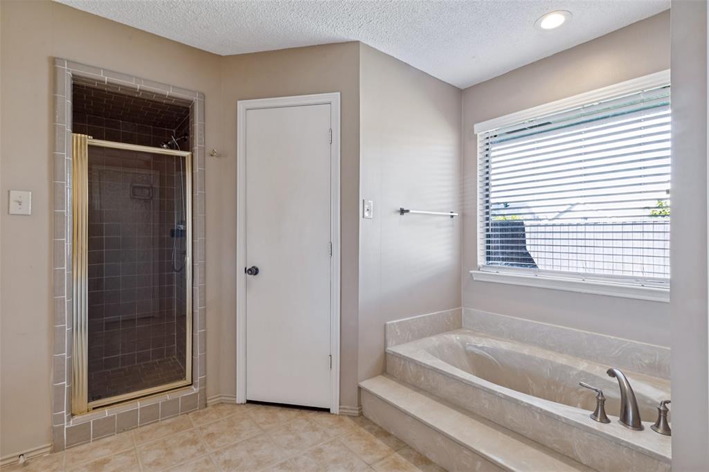 Separate walk in shower and soaking tub.