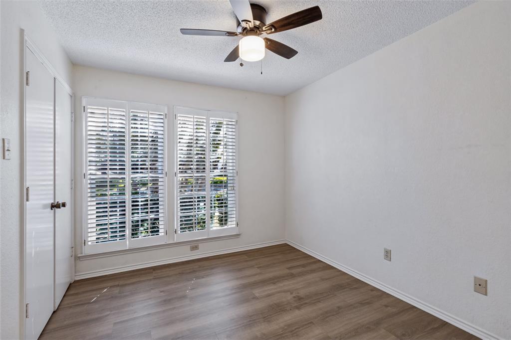 Secondary bedroom has a nicely sized closet and new ceiling fan.