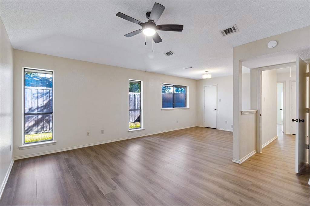 Primary bedroom also has direct access to the patio and backyard area.
