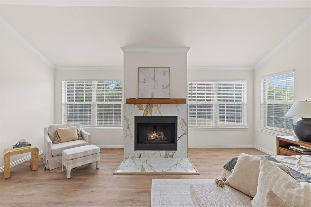 Primary bedroom with wood burning fireplace