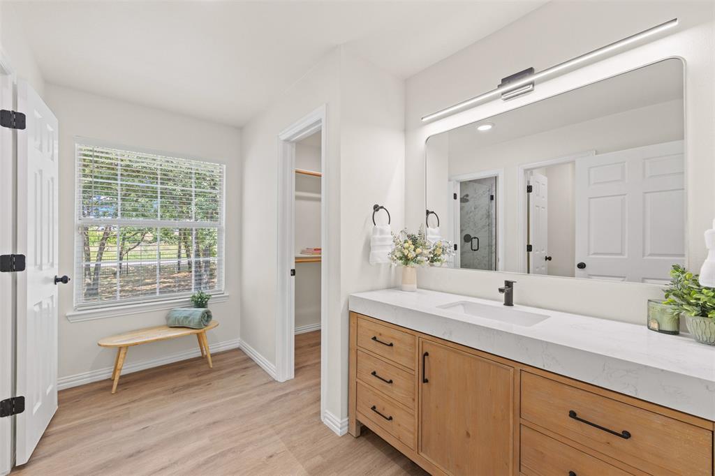 Upstairs bathroom with additional walk in closet for storage