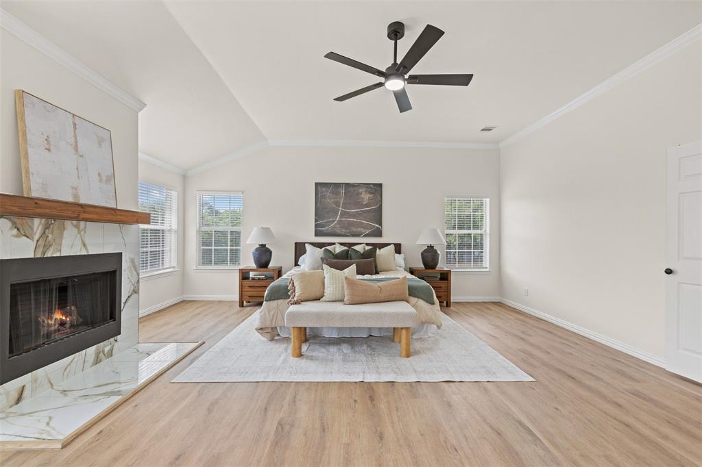 Primary bedroom with wood burning fireplace