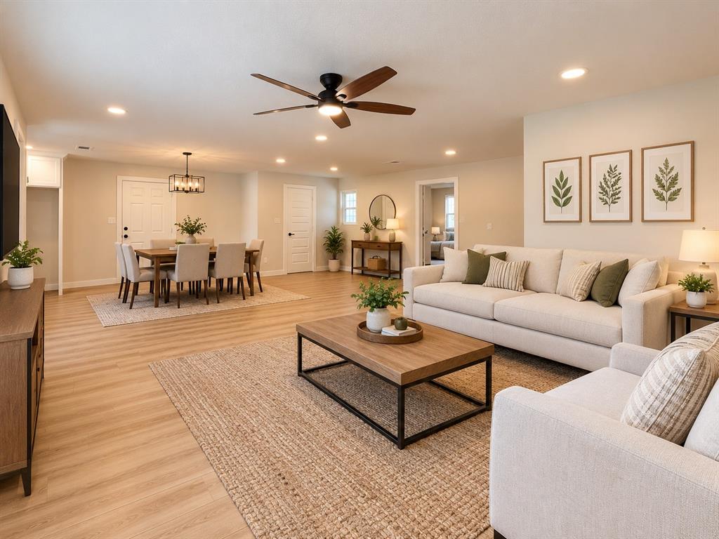 Open-concept interior featuring wood-finish flooring, recessed lighting, and a modern ceiling fan