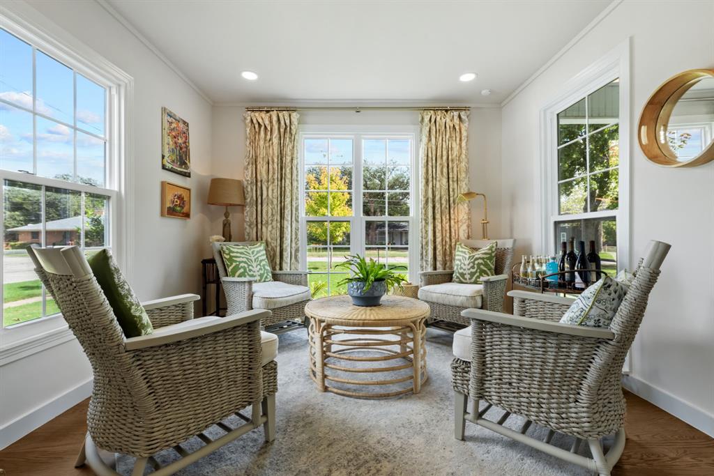 The charming Keeping Room, nestled alongside the beautifully renovated kitchen, offers a warm and inviting retreat for morning coffee, casual conversation, or simply relaxing in the heart of the home.