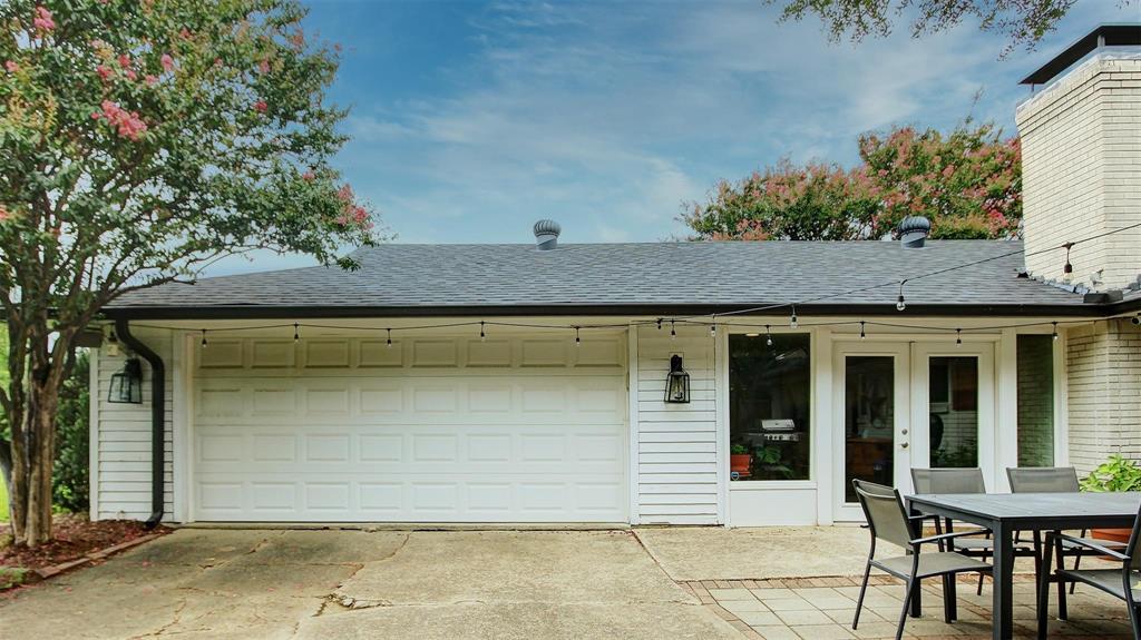 View of 2 stall garage with side entry as you enter in the front thru your driveway security gate. Plenty of additional parking in the rear of the house.
