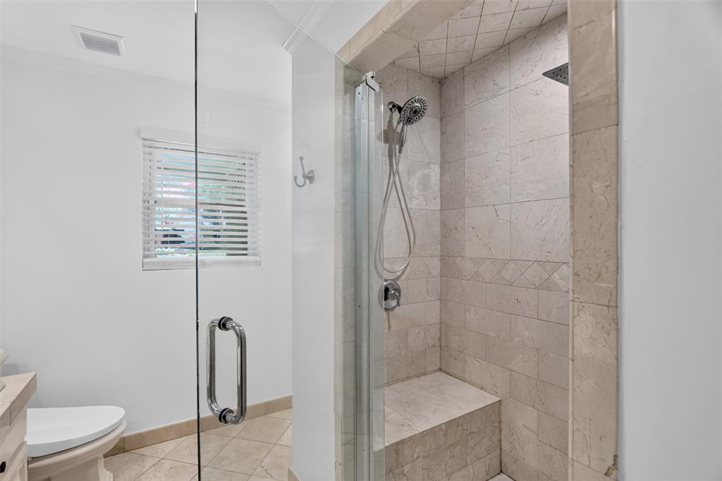 View of primary bath oversized shower enclosure.  Bathrooms was freshly painted August 2026