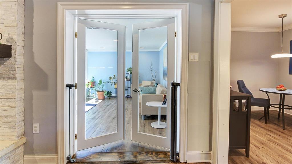 Entrance to your sunroom off the living room & kitchen. Glass doors allow for more natural light. Nice size room could be used for plants, childrens' playroom, exercise room, endless possibilities.