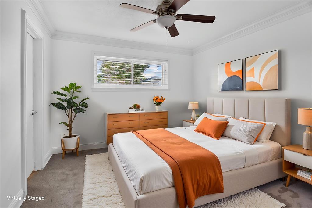 One of 3 bedrooms, Carpeted, ceiling fan-light combination. Full size closet. Window with blinds. Door access to Jack N Jill bath.  August 2026 walls freshly painted Room would make for a nice home office