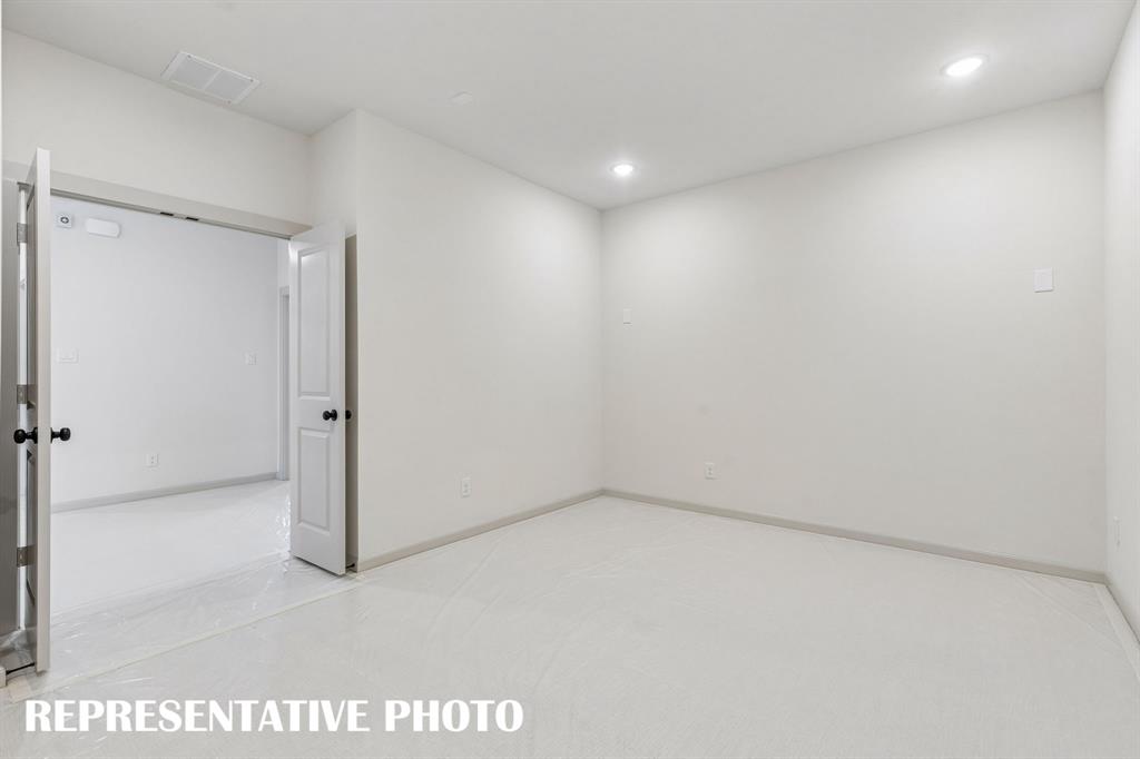The spacious media room paired with adjacent game room create the ultimate family entertainment zone!  REPRESENTATIVE PHOTO