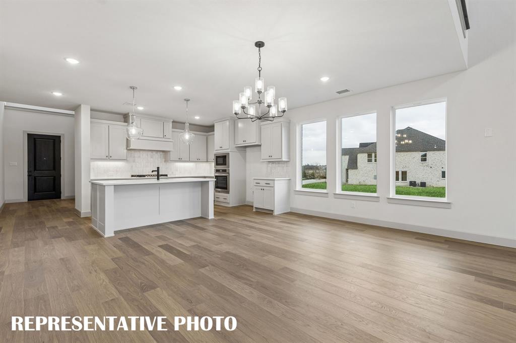 Offering a light filled, open and flowing design, our Toulouse II plan is an entertainer's dream home!  REPRESENTATIVE PHOTO