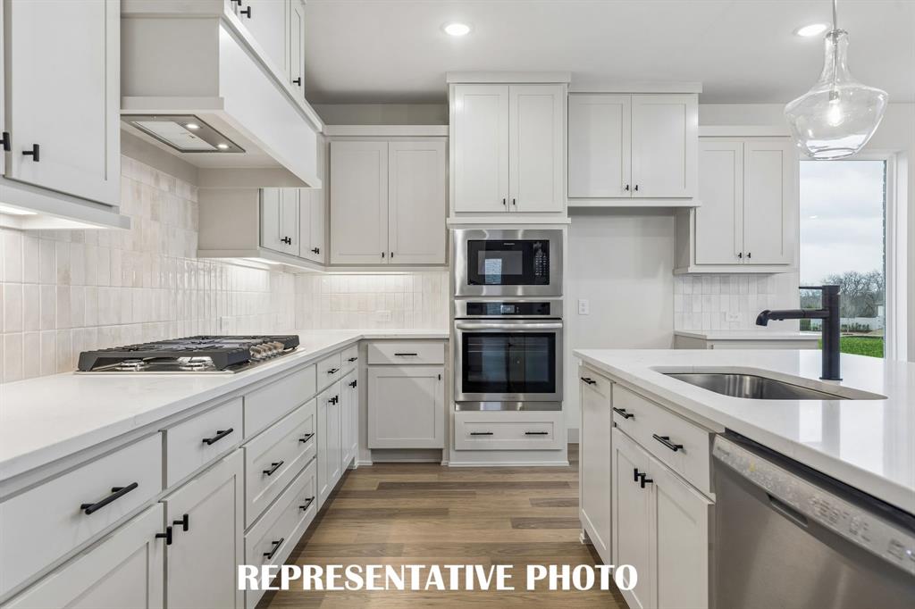 Beautiful cabinetry, gorgeous countertops, top of the line stainless steel appliances....this stunning kitchen is everything you have been searching for!  REPRESENTATIVE PHOTO