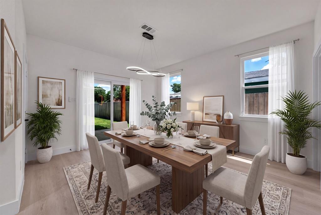 Dining area featuring wood-finish flooring, sliding glass door, and modern sculptural chandelier