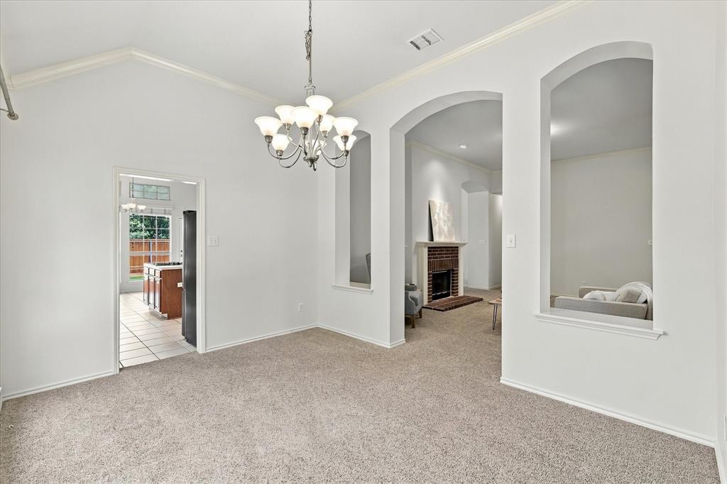 Dining room features high ceilings, natural light and flows to formal living and kitchen.