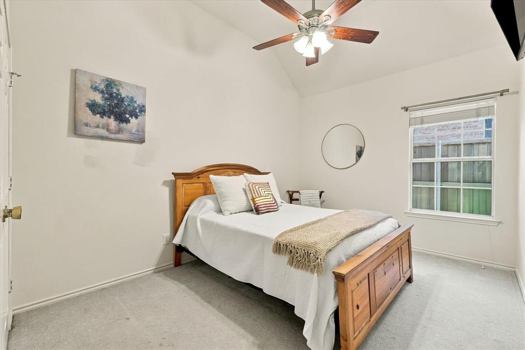 Spare bedroom with queen size bed.