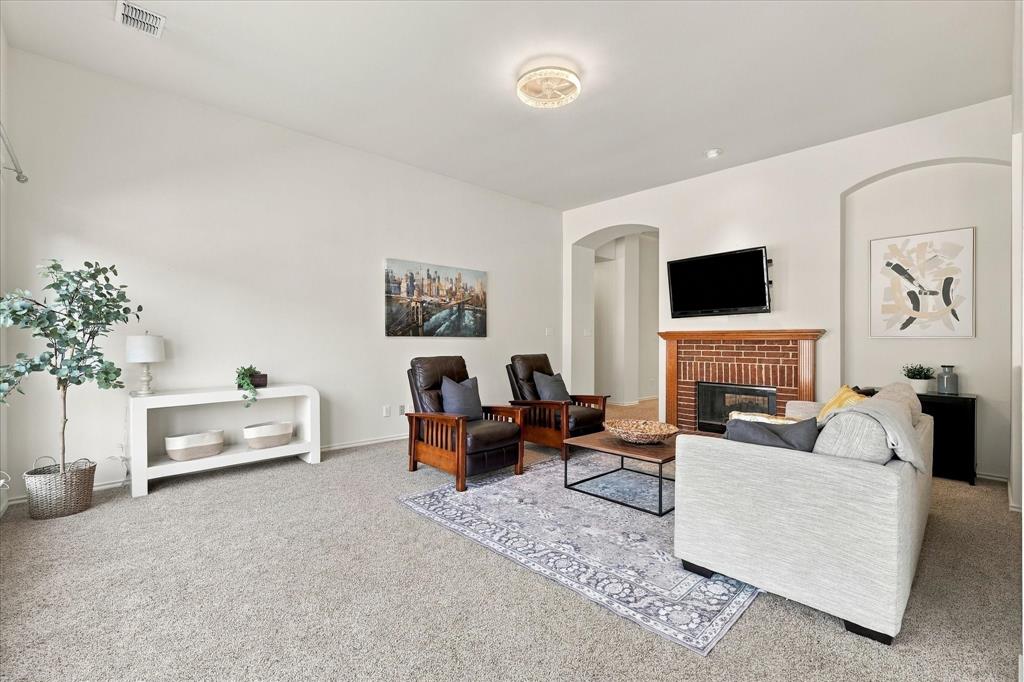The den features natural light and space for a sectional.