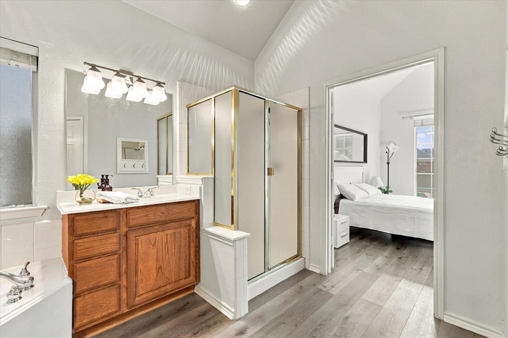 Separate shower, bathtub, and dual vanities for easy morning routines