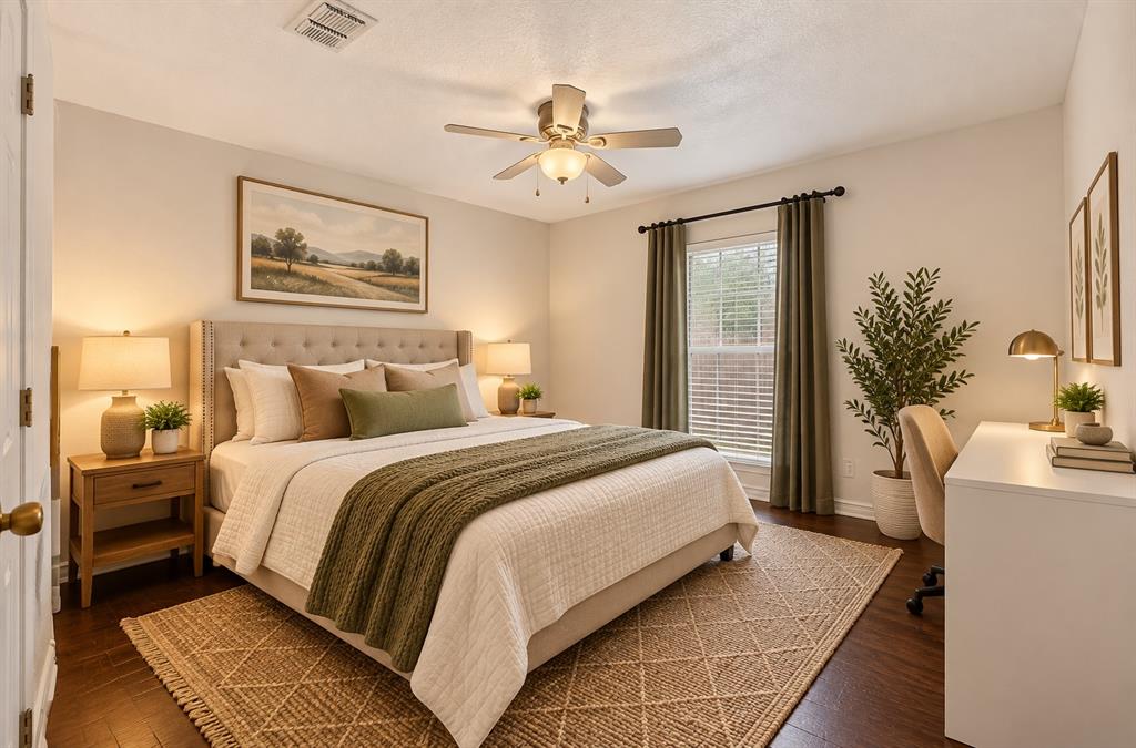 Neutral-toned interior space featuring wood-finish flooring, a ceiling fan with integrated light fixture, and a window with horizontal blinds