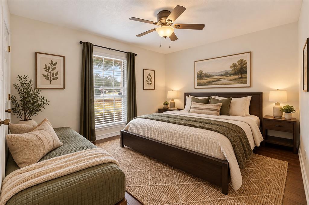 Neutral wall tones, wood-finish flooring, energy-efficient window with horizontal blinds, and a central ceiling fan with integrated lighting
