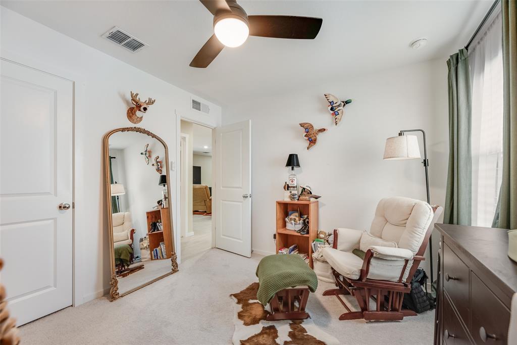 Room featuring neutral carpeting, a ceiling fan with integrated lighting, and two-panel interior doors