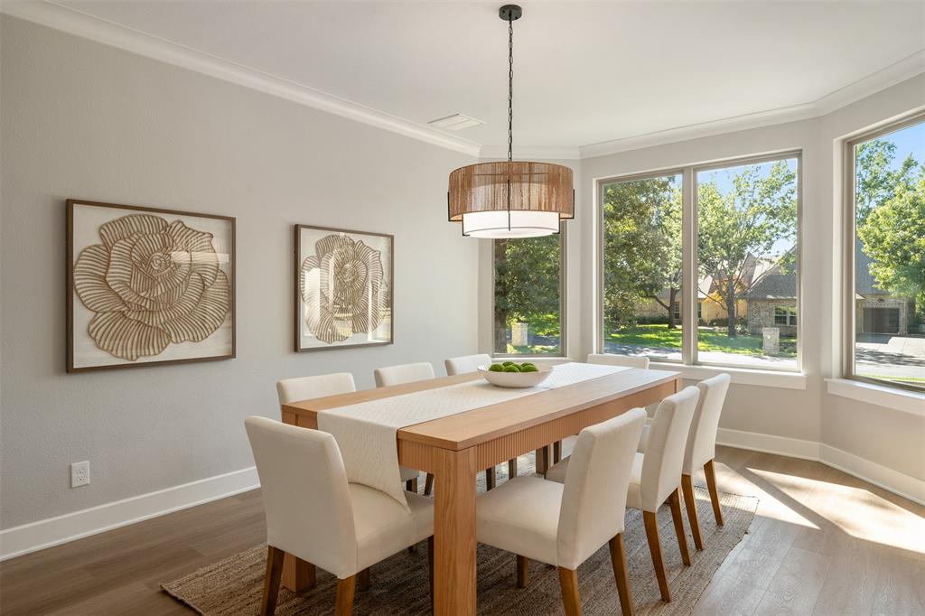 Bright airy dining room with a charming bay window