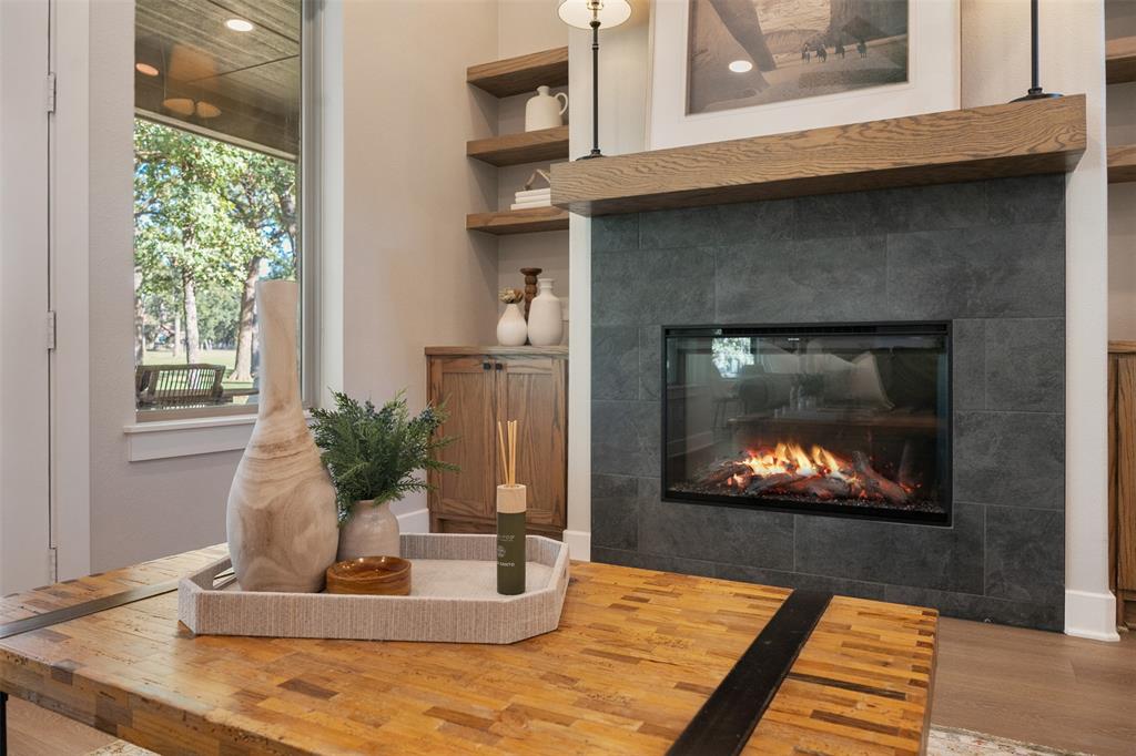 Inviting fire place with custom shelving and storage