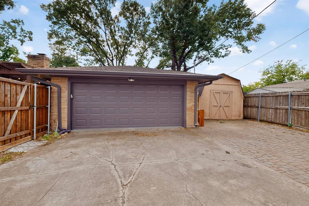 Rear garage entry & shed