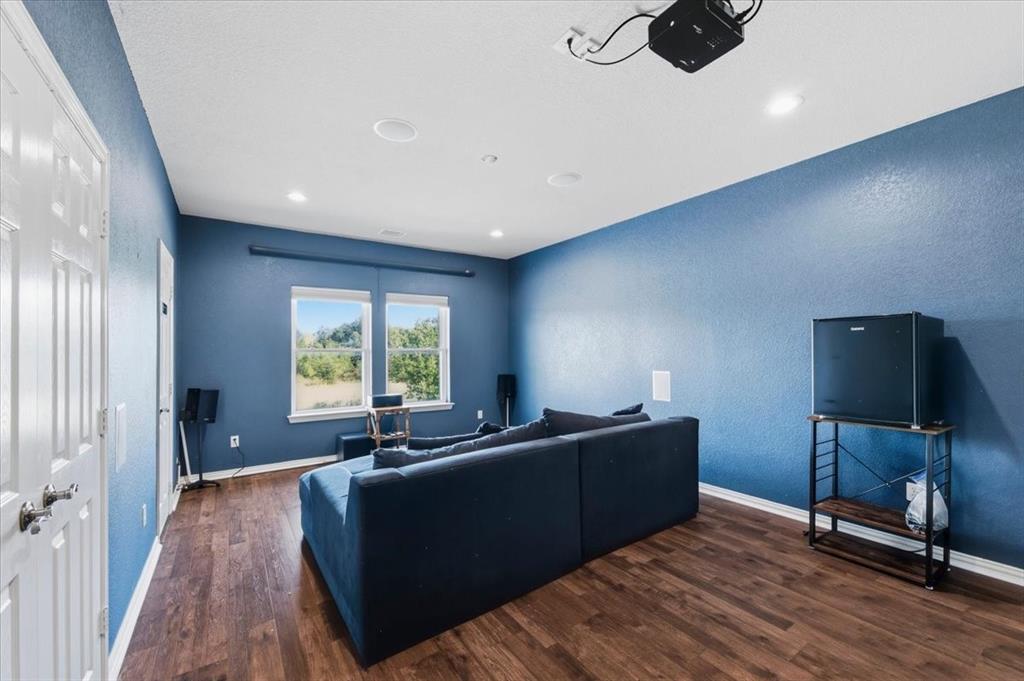 Upstairs living area being used as a media room with Murphy Bed.