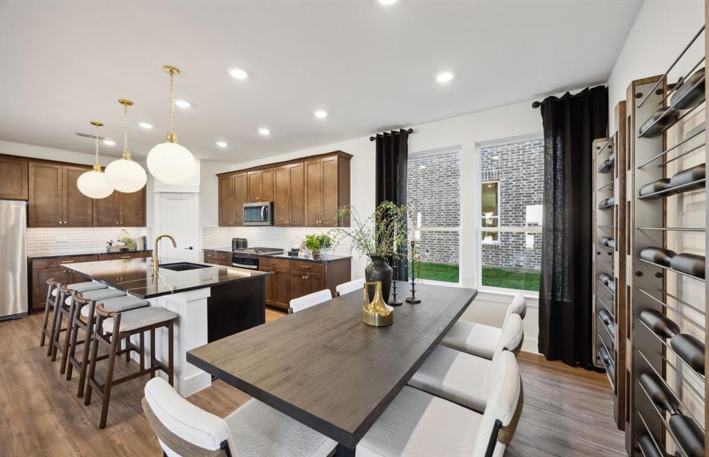 *Model Representation - Dining area off kitchen with large windows