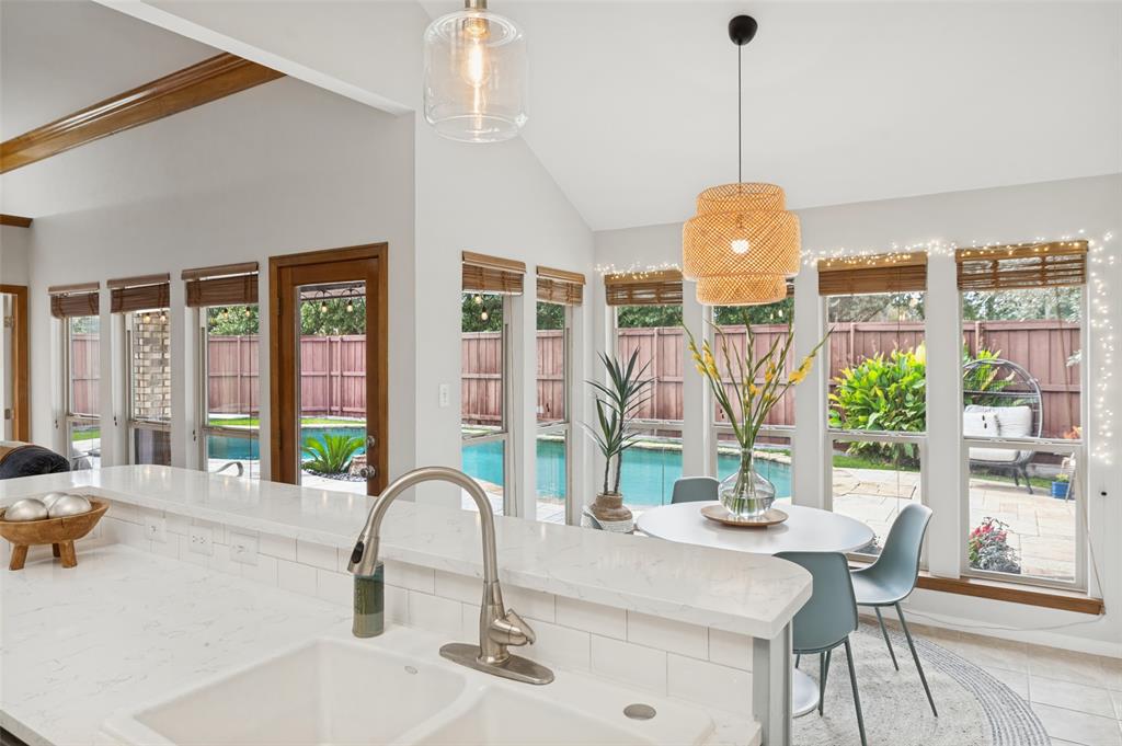 Enjoy the view of the pool area while cooking