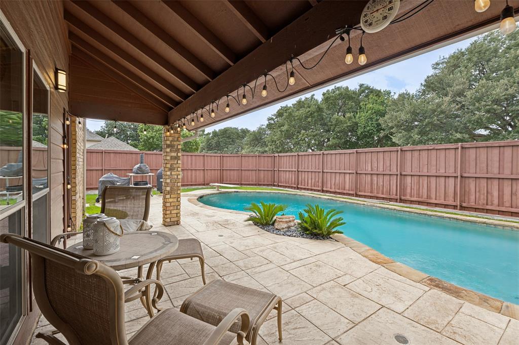 Covered patio area overlooking the pool