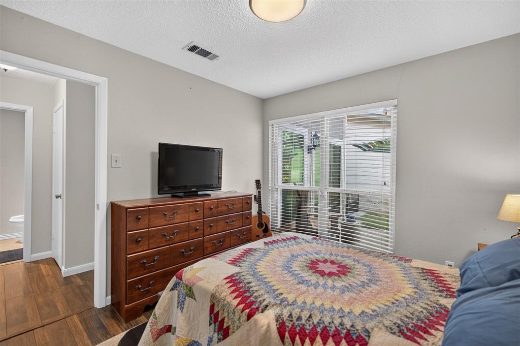 Neutral wall tones, ceiling-mounted lighting, and dual white bi-fold closet doors