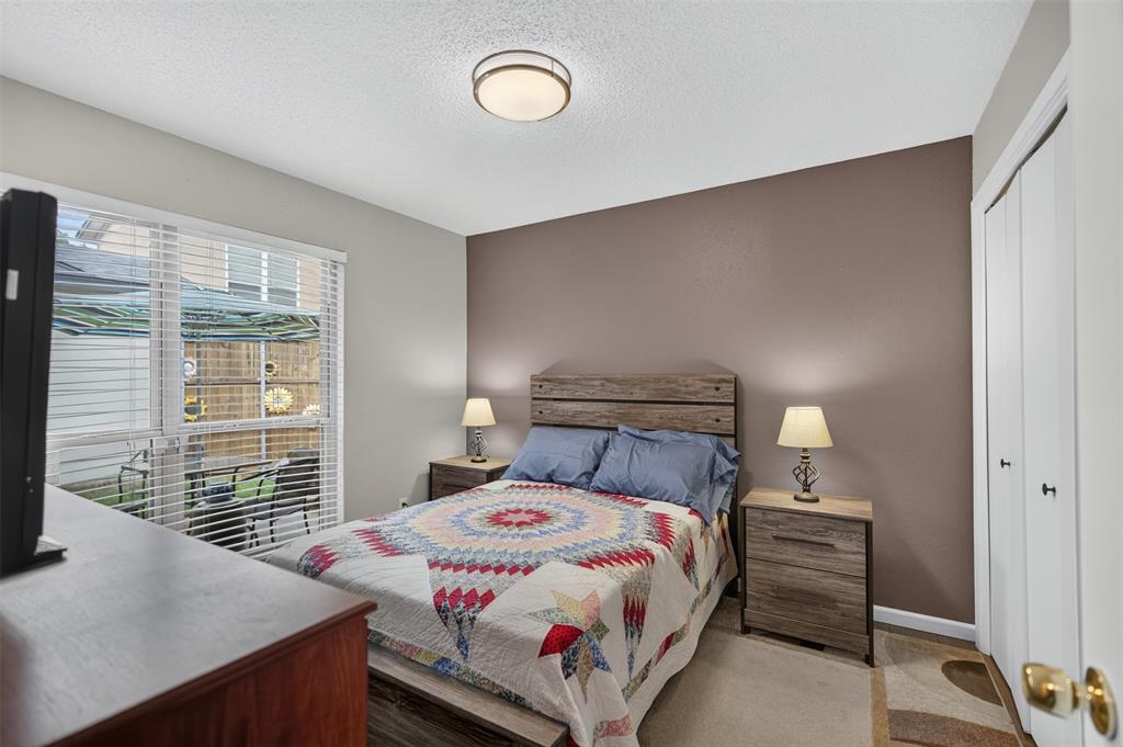 Neutral wall tones, ceiling-mounted lighting, and dual white bi-fold closet doors