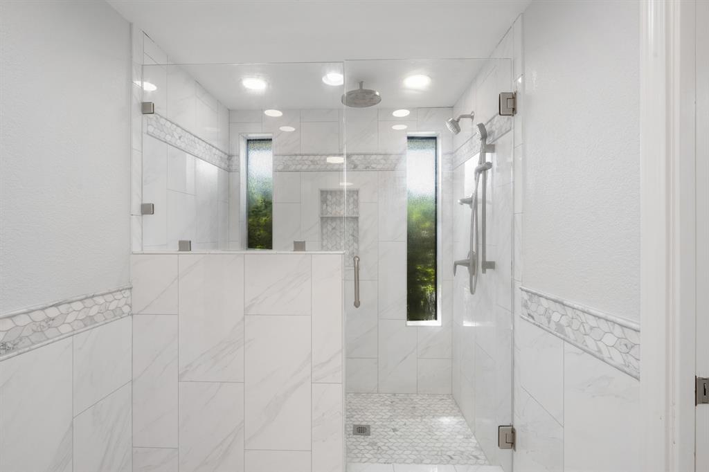 Stunning walk in shower with natural light.