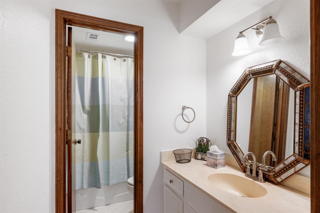 Secondary bathroom with built in storage.