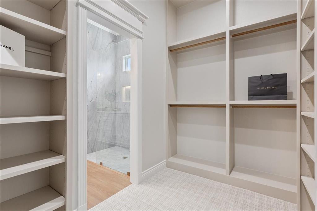 Primary closet with access to Laundry room
