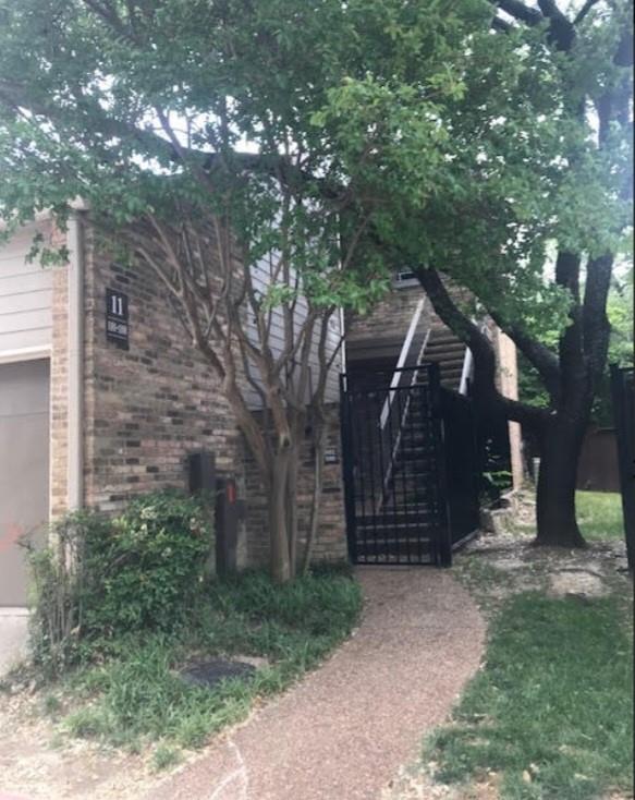 View of front of home featuring a garage and a gate View of front of home featuring a garage and a gate
