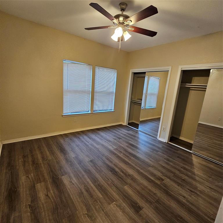 Bedroom with mirror closets