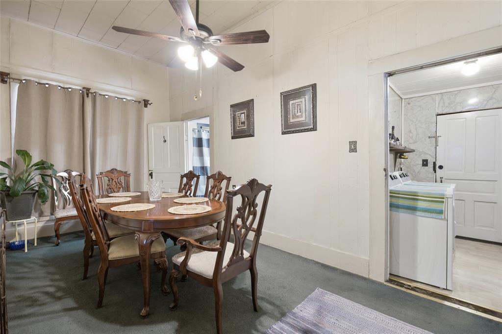 Plank-paneled walls and ceiling, ceiling fan with integrated lighting, and multi-panel solid doors