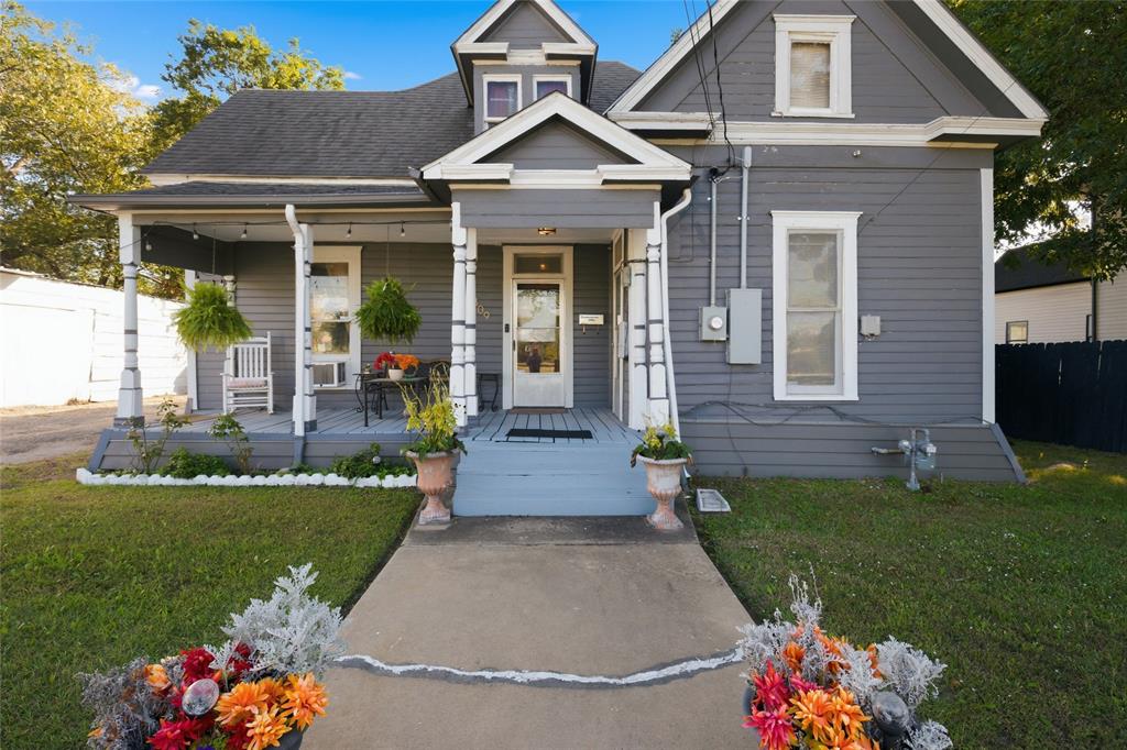 Craftsman-style exterior featuring horizontal siding, a covered front porch with decorative columns, a gabled roofline, and a central entryway with a glass-paneled door Craftsman-style exterior featuring horizontal siding, a covered front porch with decorative columns, a gabled roofline, and a central entryway with a glass-paneled door