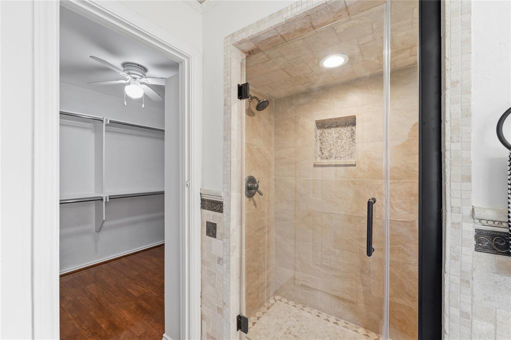 Walk-in oversized travertine shower.