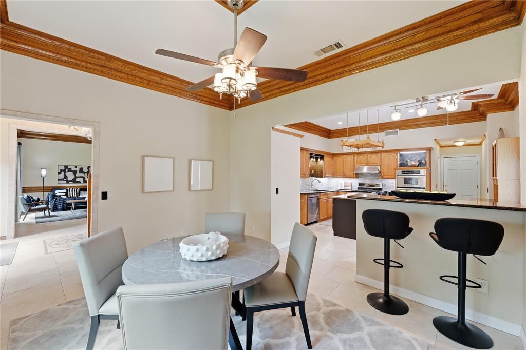 Dining room open to kitchen and breakfast bar style island.