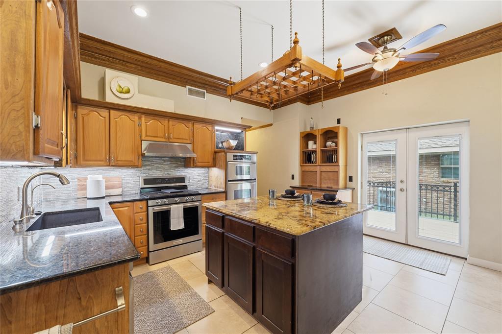 This kitchen is great for entertaining, oversized island and a breakfast bar style island this kitchen is great for hosting guests.
