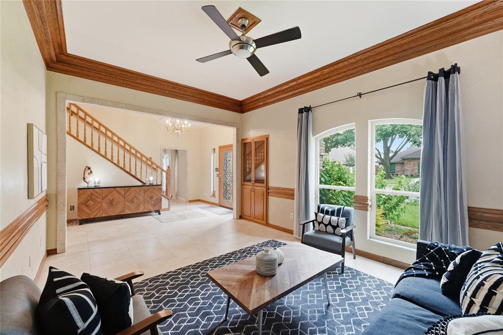 formal living in the front with built in glass shelves.