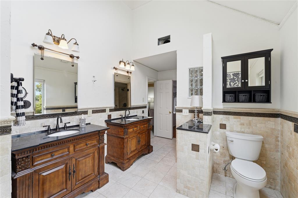 The primary bath doesn't disappoint, is offers double separate vanities, garden tub and separate shower, and offers a walk-in closet and a nice skylight that offers natural light.