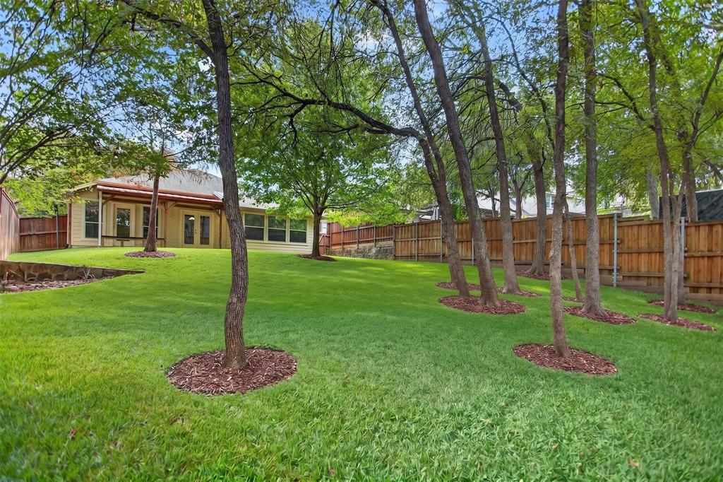 Expansive backyard featuring, beautiful mature trees, wood privacy fencing, and with Greenbelt