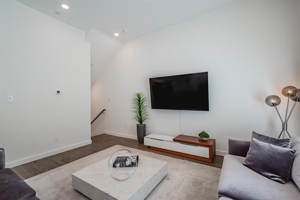 High ceilings, wood-finish flooring, and recessed lighting