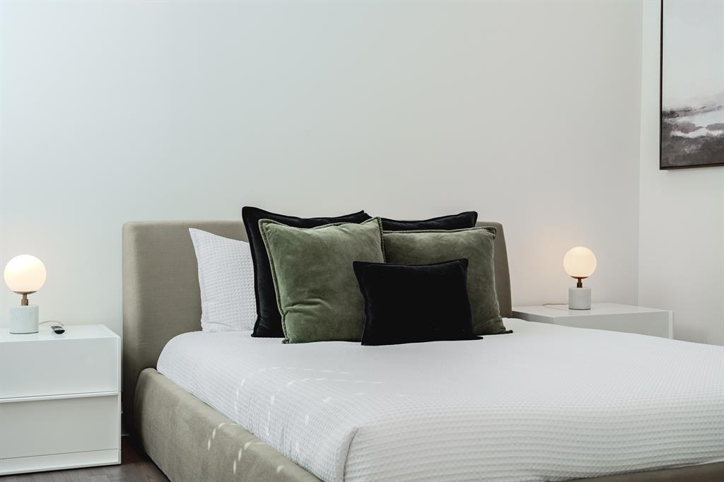 Neutral-toned upholstered headboard with a low-profile frame