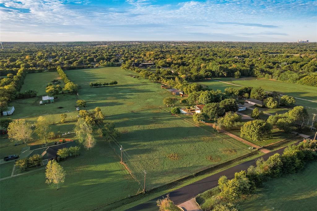 Expansive parcel featuring level pasture land, mature trees, and perimeter fencing Expansive parcel featuring level pasture land, mature trees, and perimeter fencing